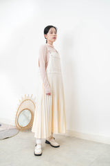 Cream worker pleats skirt with red outline stitches