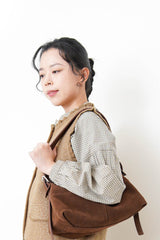 Brown suede leather pillow bag w/ adjustable straps