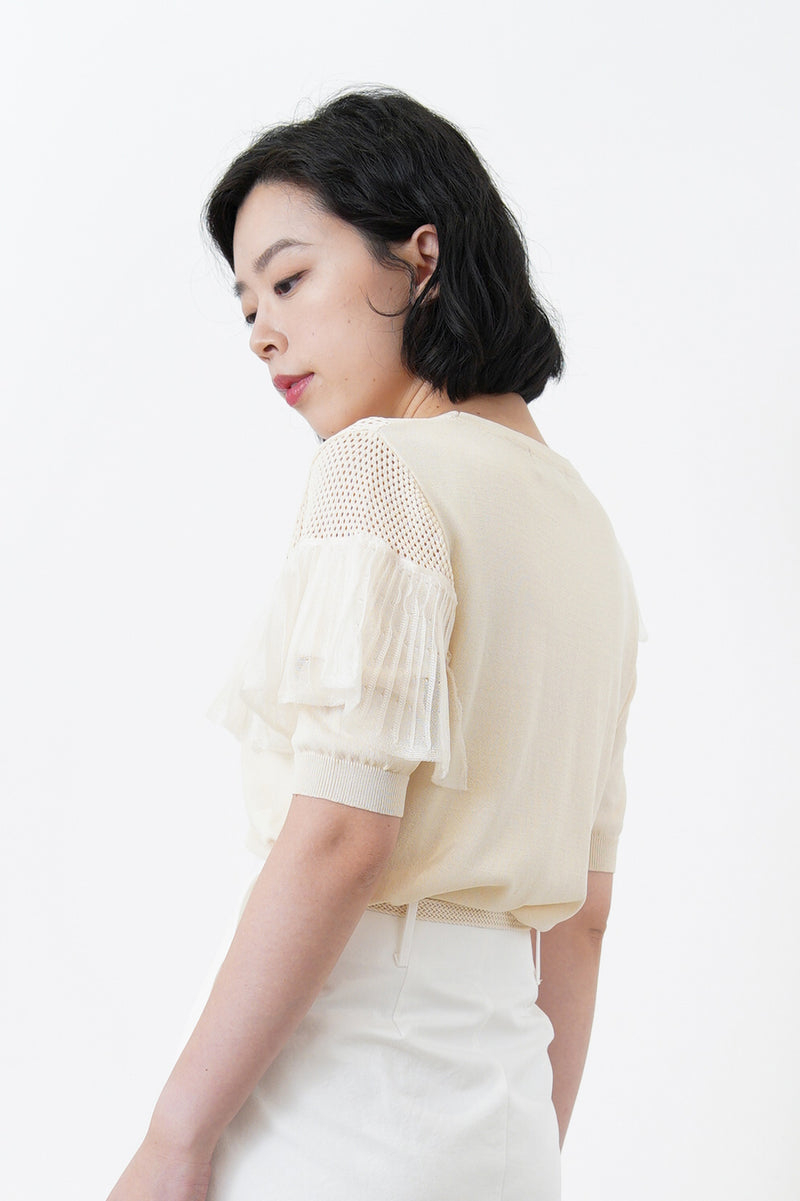 Cream top w/ peplum ruffle detail