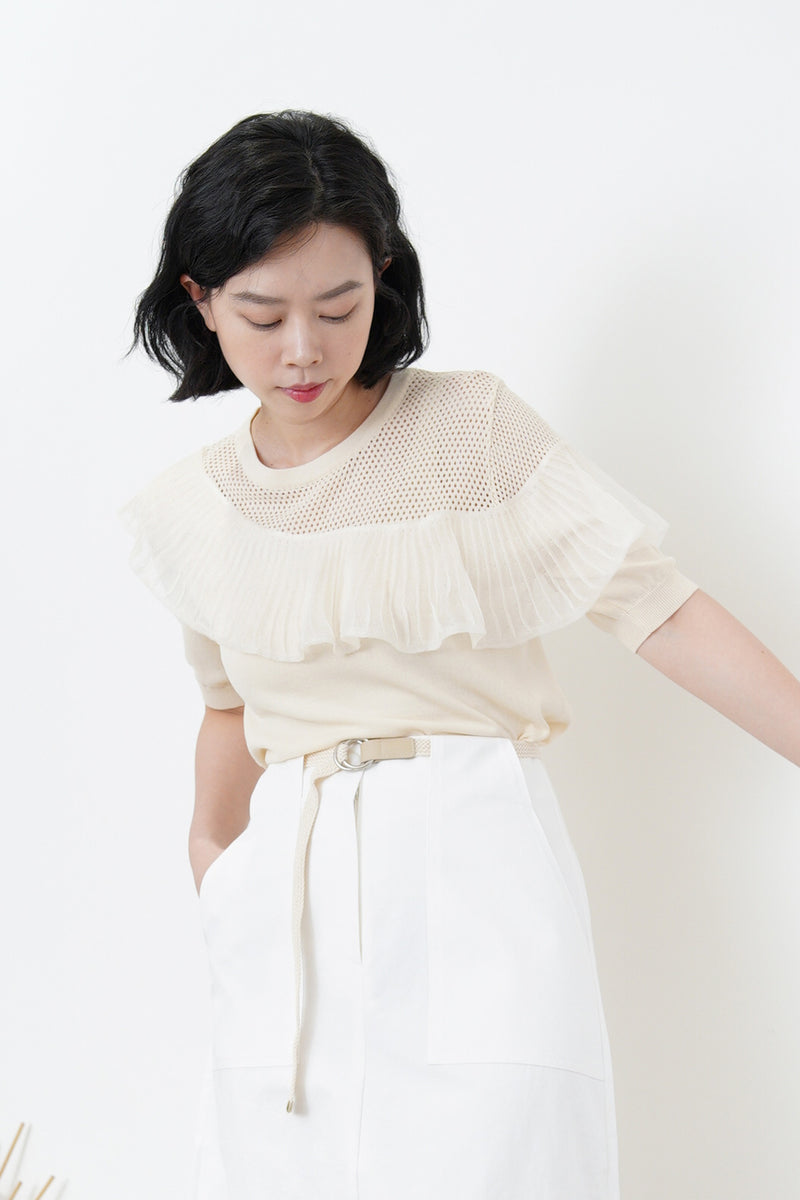 Cream top w/ peplum ruffle detail