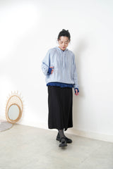 Navy thin top w/ peplum hem