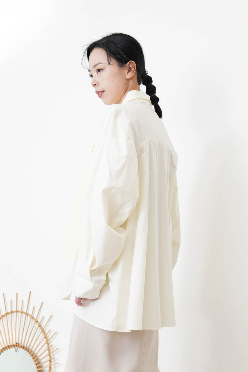 Cream long shirt with contrast patchwork pockets