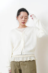 Ivory thin top w/ peplum hem