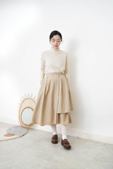 Beige pattern knit tip w/ ruffle fringe