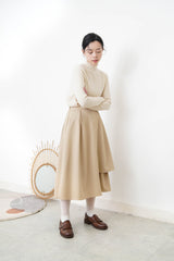 Beige pattern knit tip w/ ruffle fringe