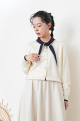 White knit cardigan w/ knot tie collar