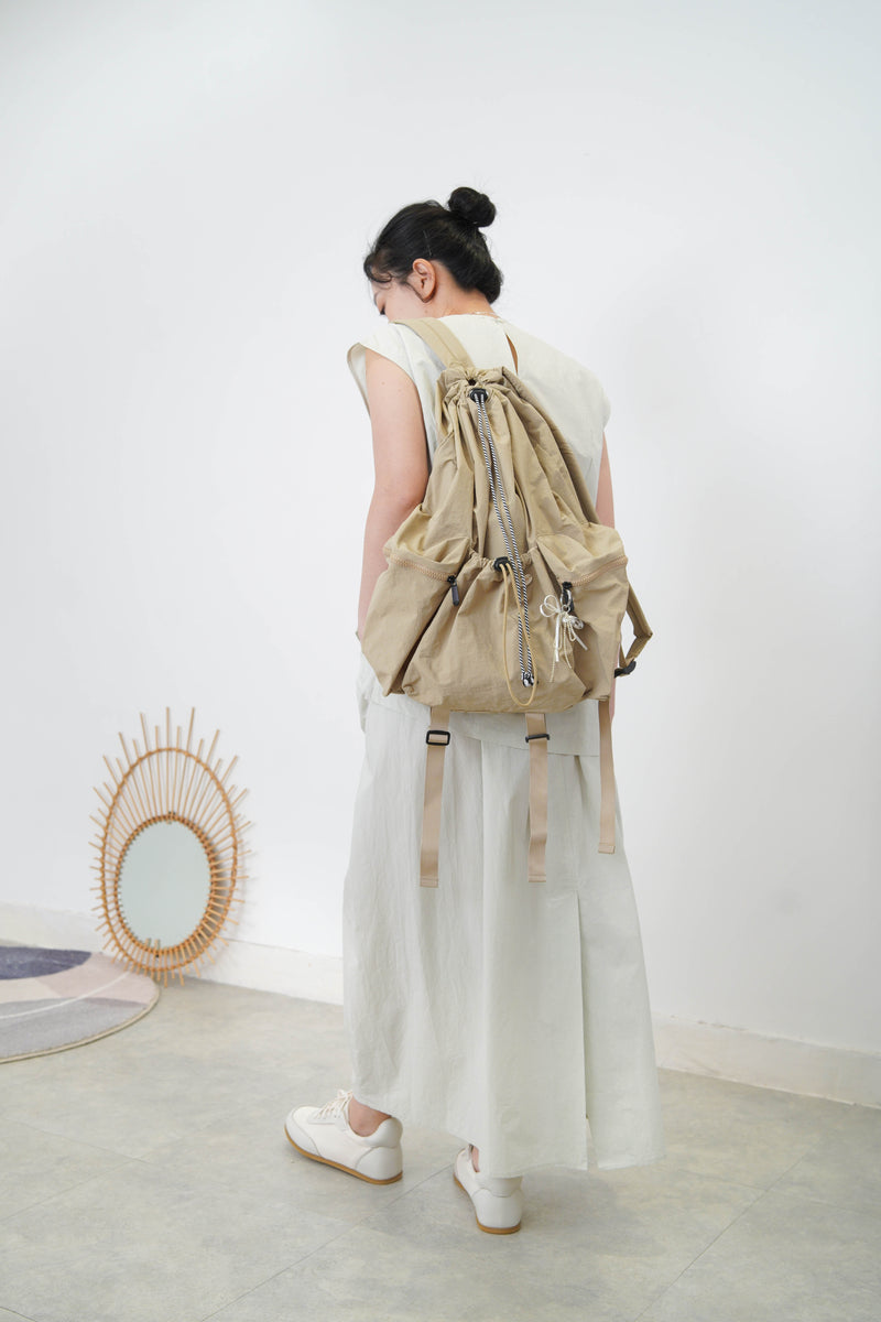 Beige drawstring backpack