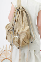 Beige drawstring backpack