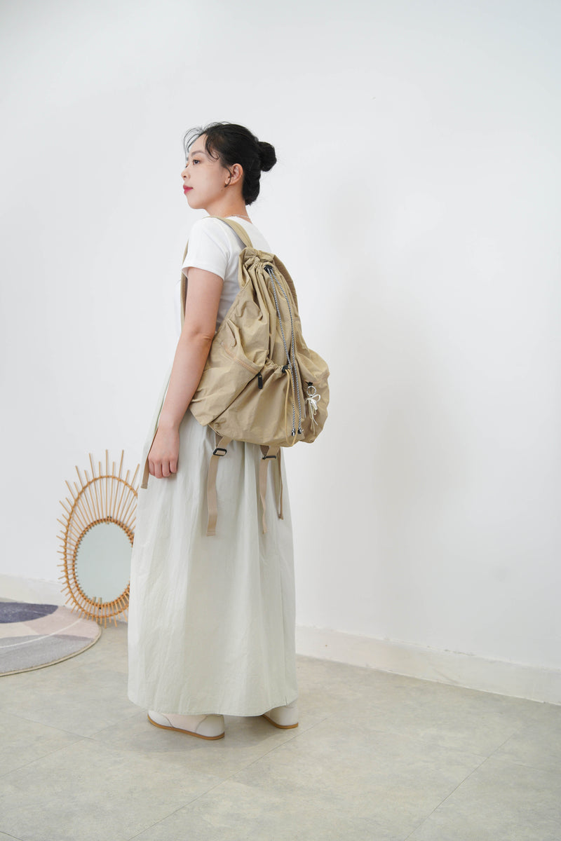 Beige drawstring backpack