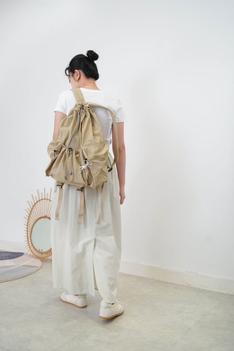 Beige drawstring backpack