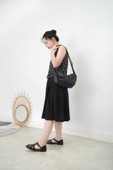 Black vest in peplum hem