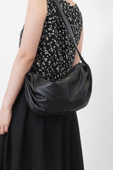 Black vest in peplum hem