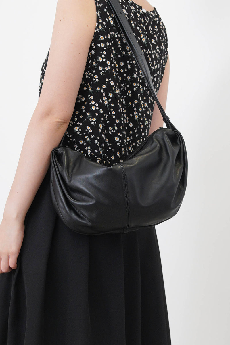 Black vest in peplum hem