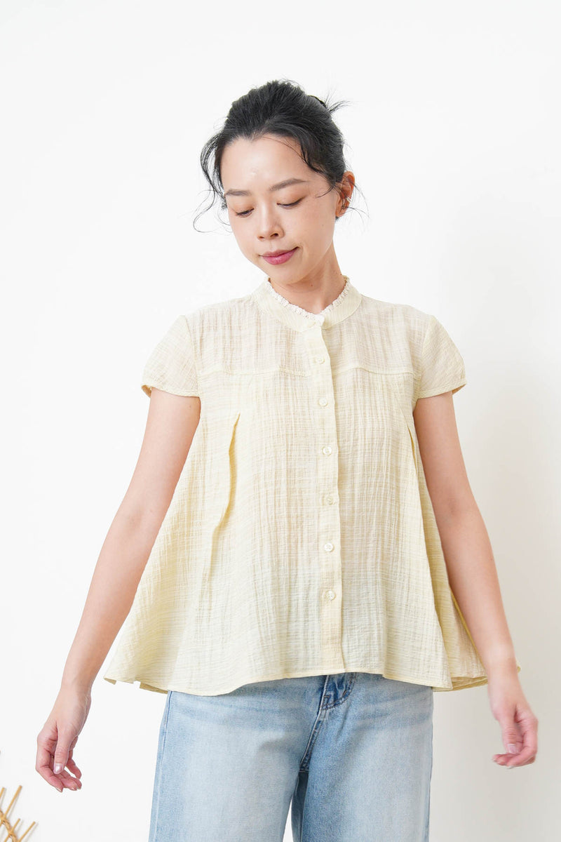Yellow blouse in lace round neck