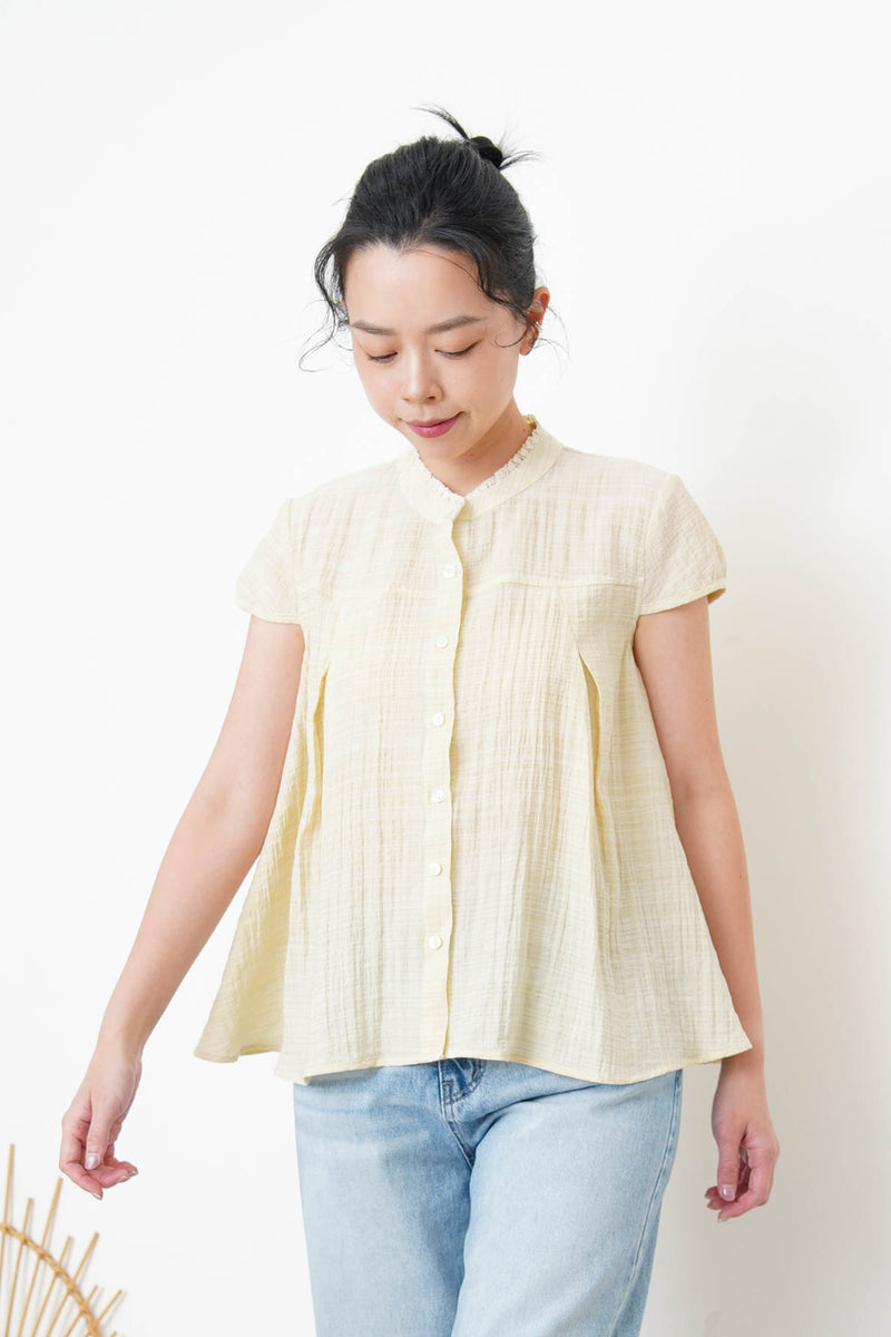 Yellow blouse in lace round neck