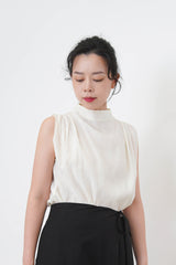 Ivory high neck blouse in pleats shoulders