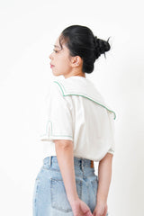 White linen sailor top in green stitches