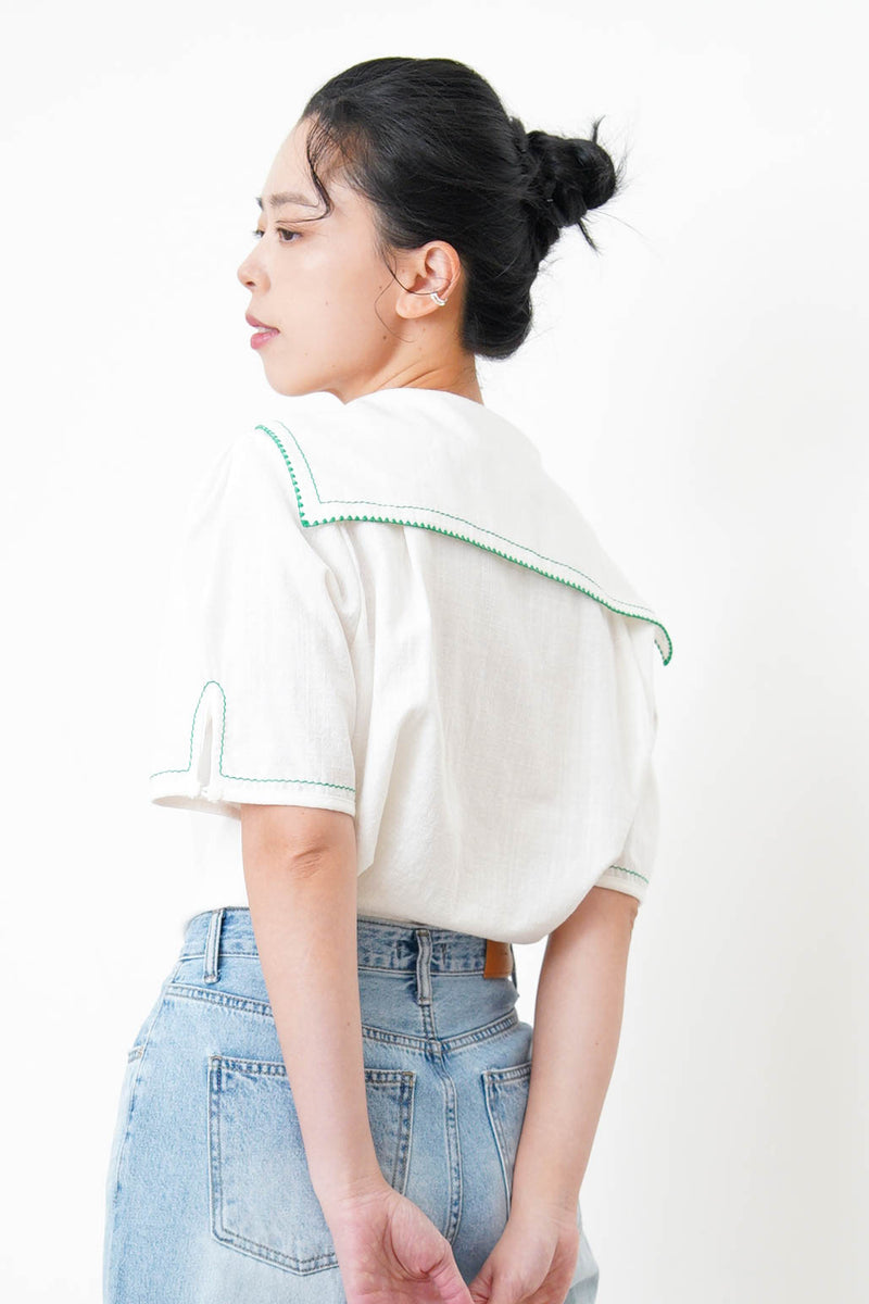 White linen sailor top in green stitches
