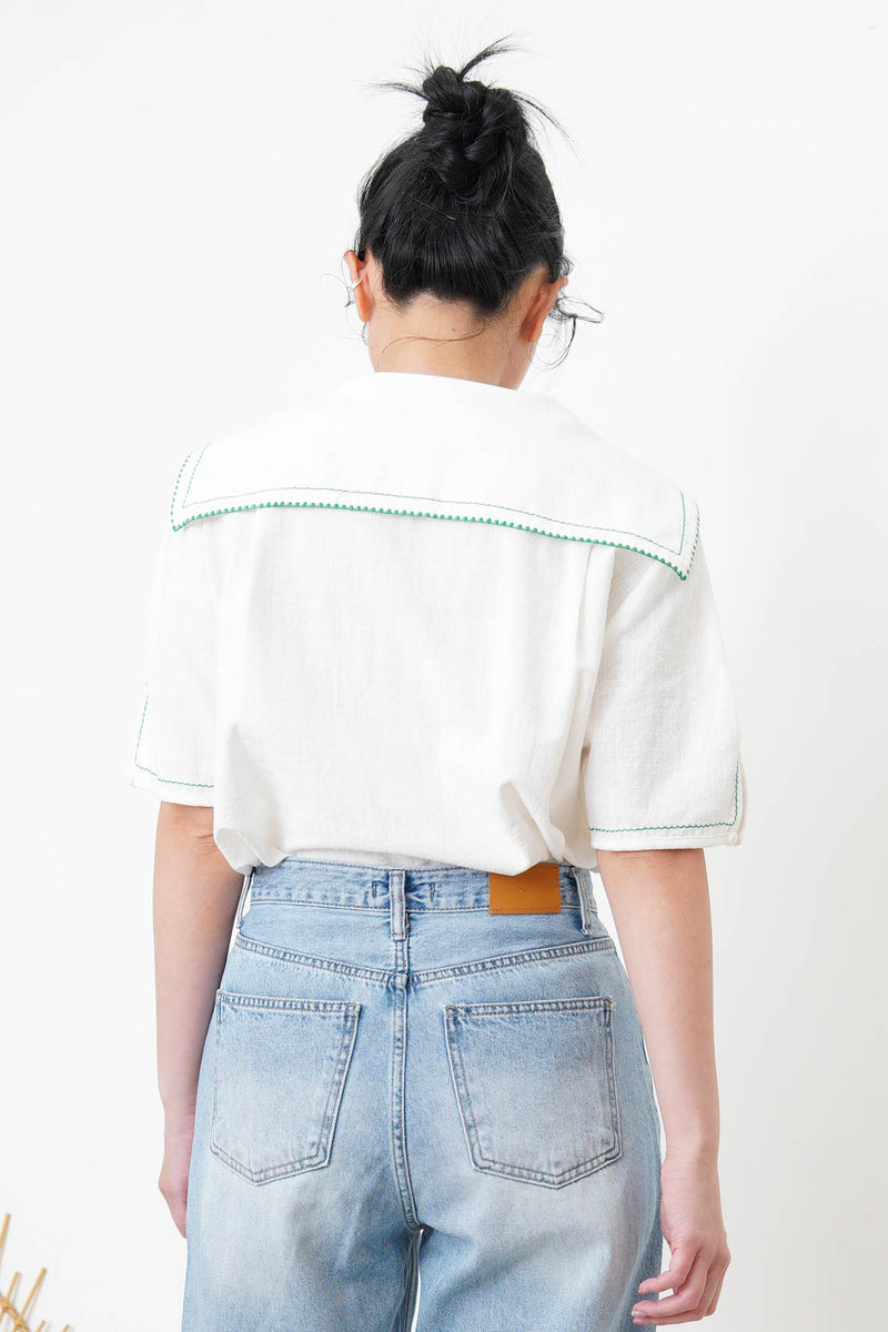 White linen sailor top in green stitches