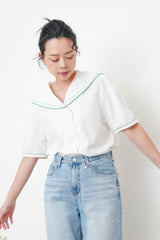 White linen sailor top in green stitches