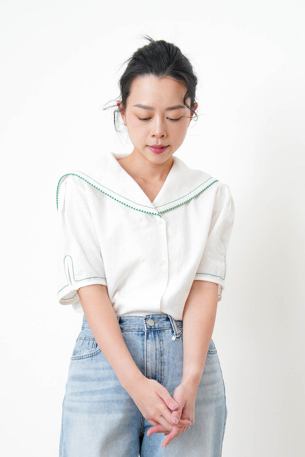 White linen sailor top in green stitches