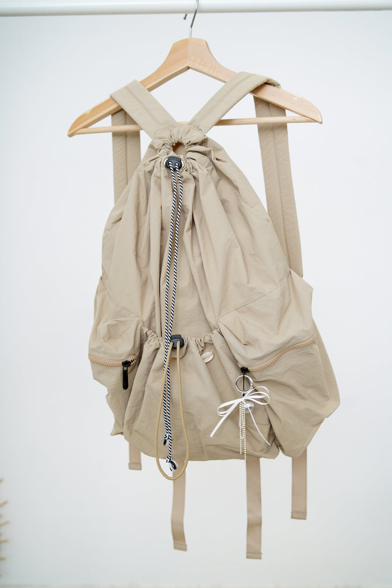 Beige drawstring backpack