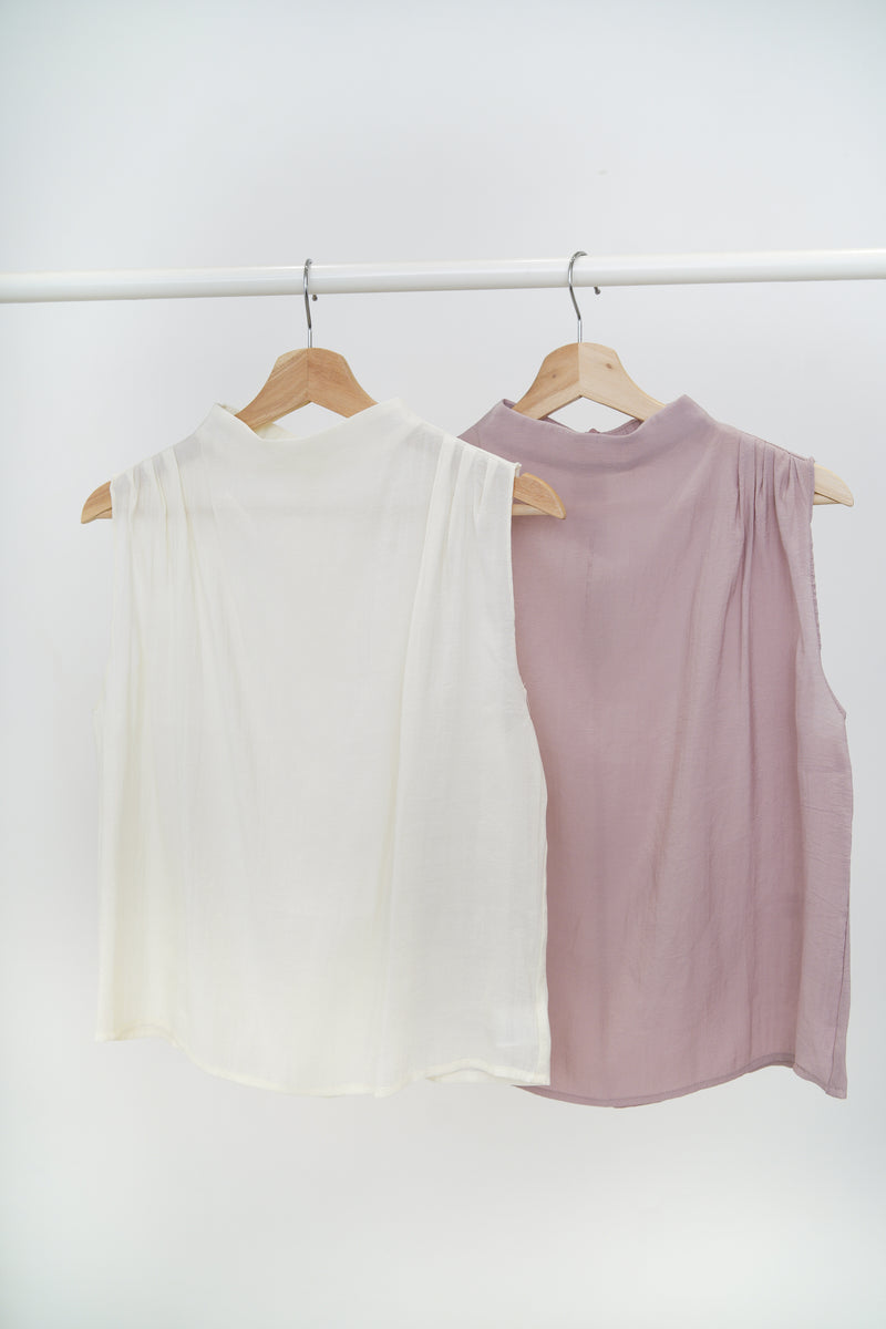 Ivory high neck blouse in pleats shoulders