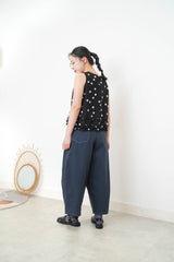 Navy dotted vest w/ ruffles hem