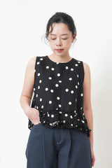 Navy dotted vest w/ ruffles hem