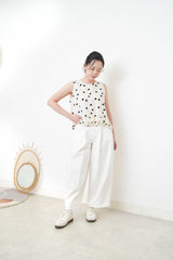 Ivory dotted vest w/ ruffles hem