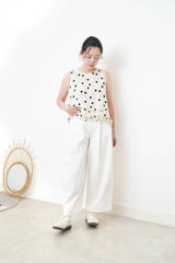 Ivory dotted vest w/ ruffles hem