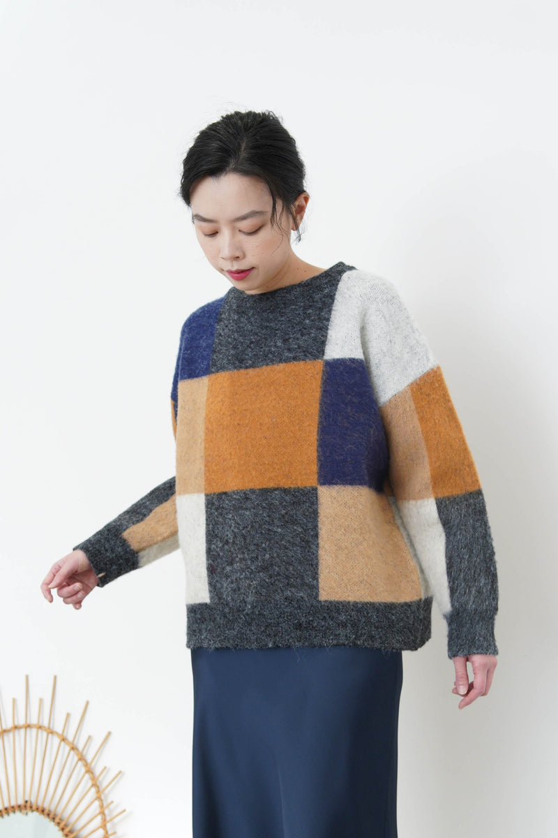 Orange mixed square pattern sweater