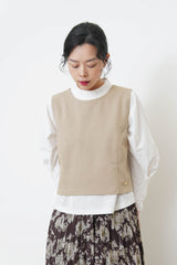 Beige vest w/ badge