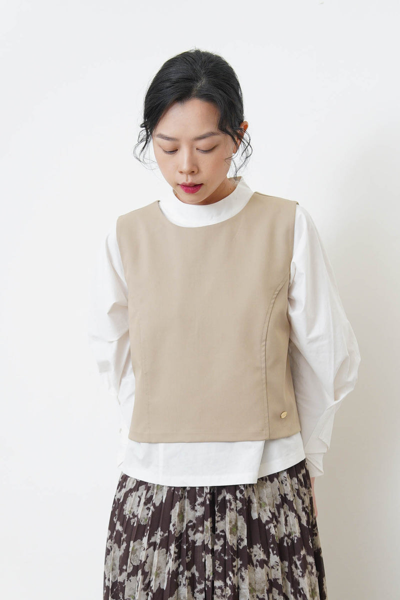 Beige vest w/ badge