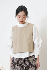 Beige vest w/ badge