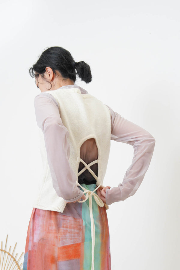 Ivory knit vest w/ strings back details