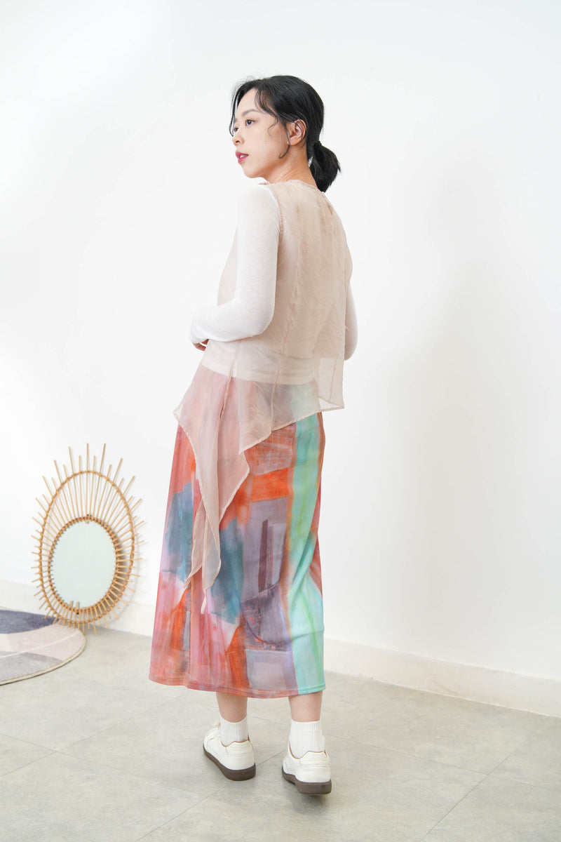 Pink sheer vest in asymmetrical cut
