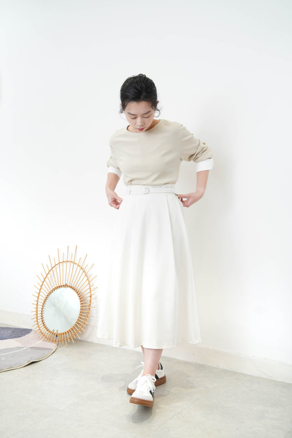 Beige top w/ white cuffs