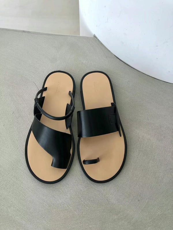 Black asymmetrical shape sandals