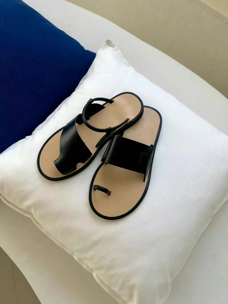 Black asymmetrical shape sandals
