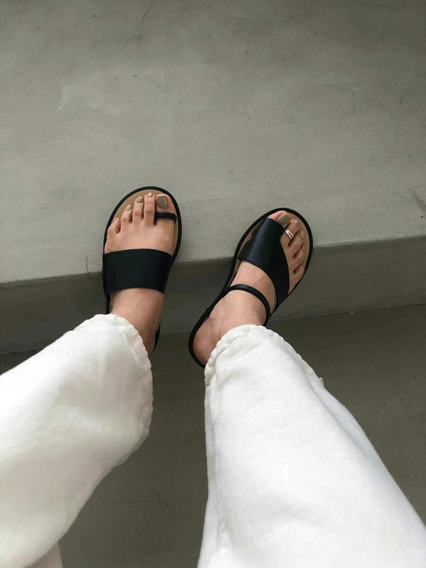 Black asymmetrical shape sandals