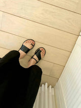 Black asymmetrical shape sandals