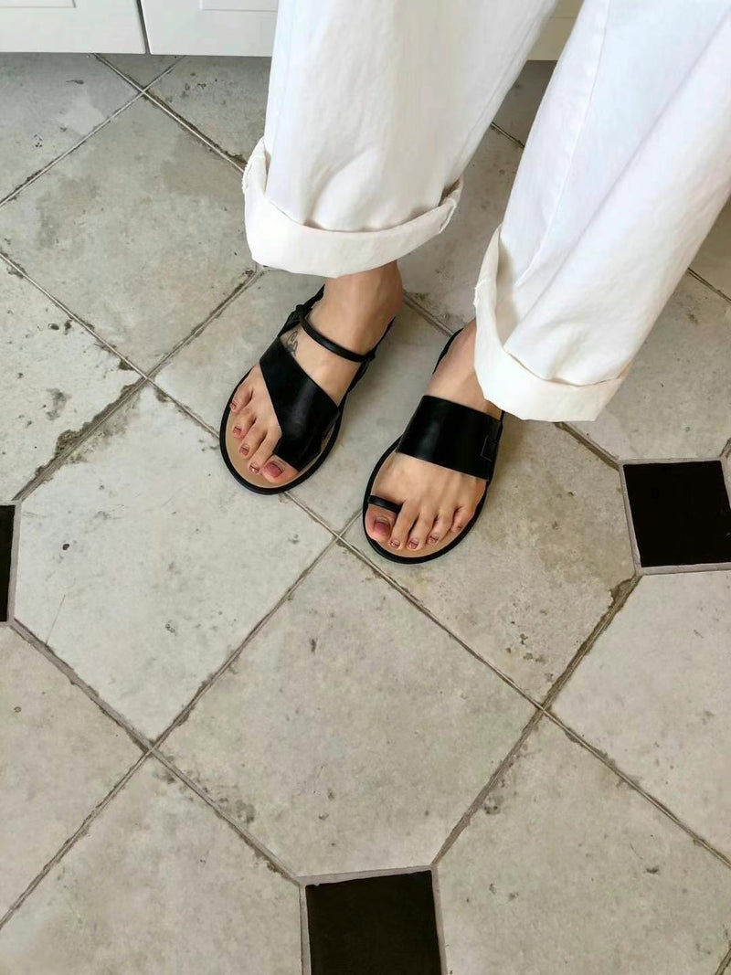 Black asymmetrical shape sandals