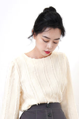 Ivory blouse in fringe trimmed details