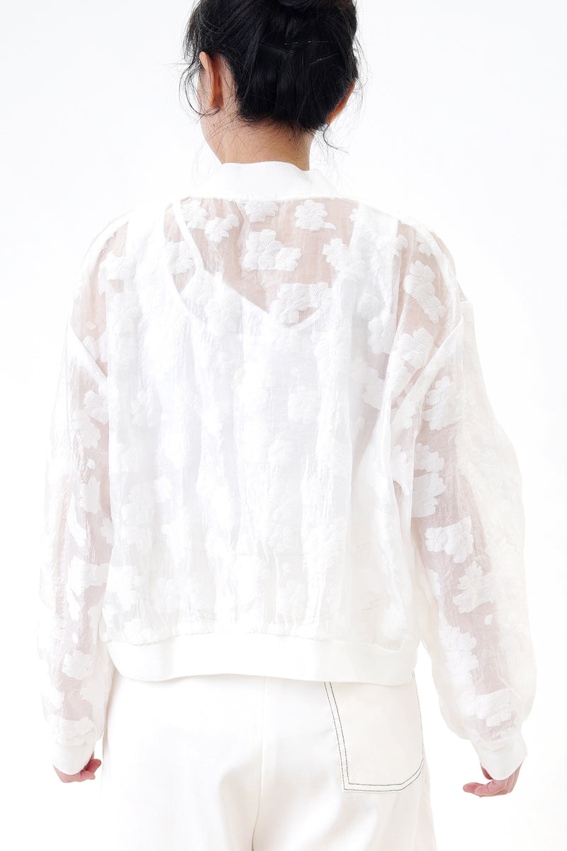 White bomber jacket in sheer floral pattern