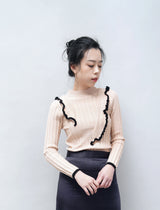 Peach knit top w/ ruffle details