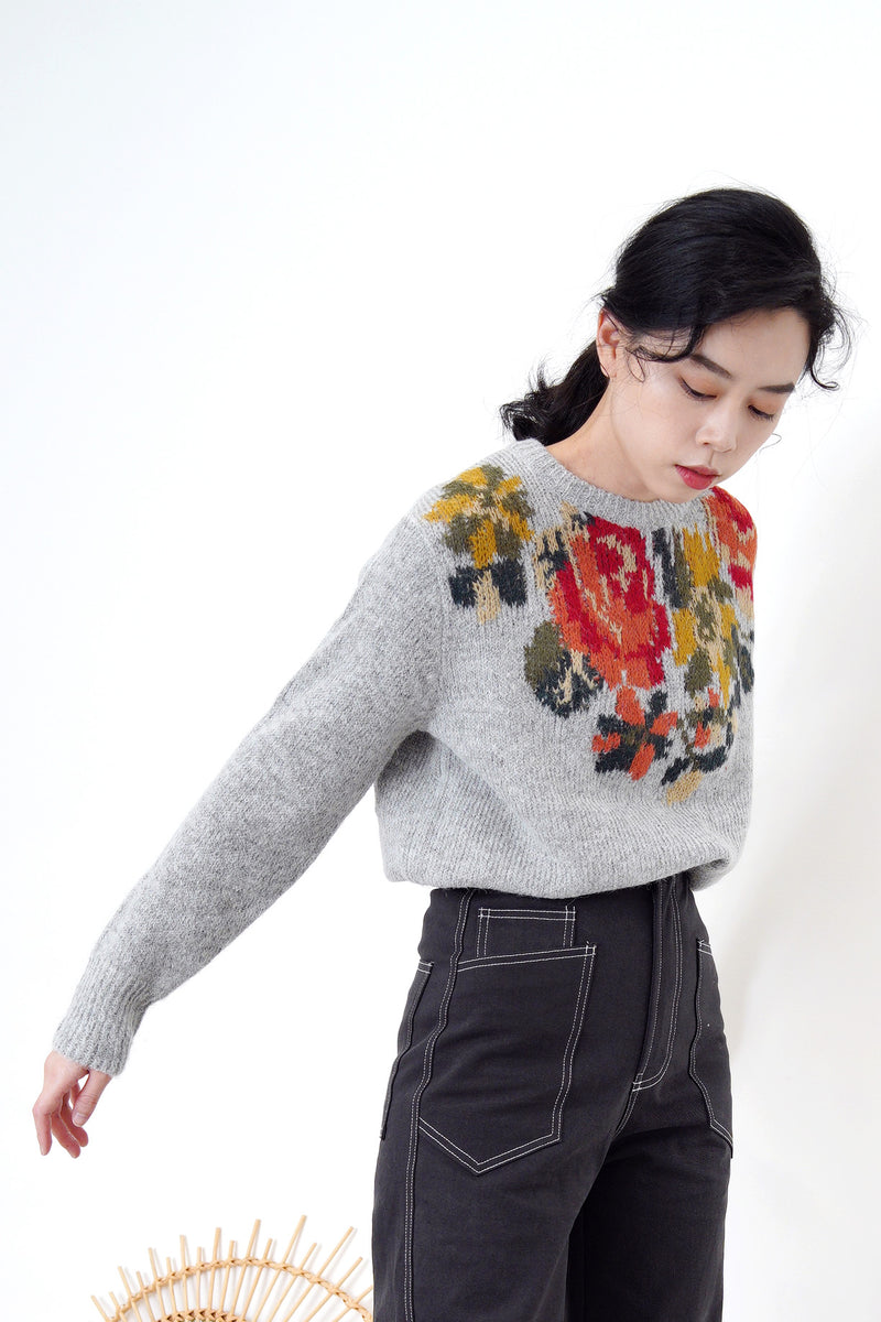 Grey knit sweater in floral cross stitch