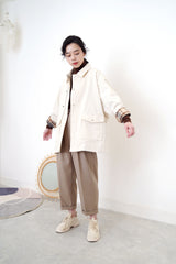 Cream jacket in brown checked inner