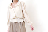 Ivory v neck knit vest in twist pattern