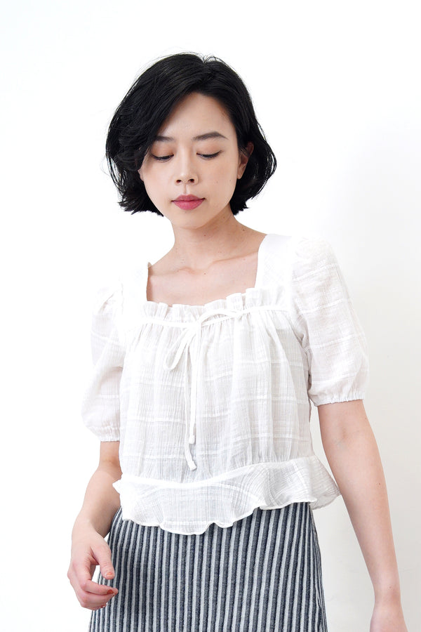 White square neck blouse in ruffle hem